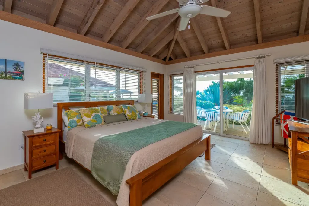 Bedroom with large bed and balcony