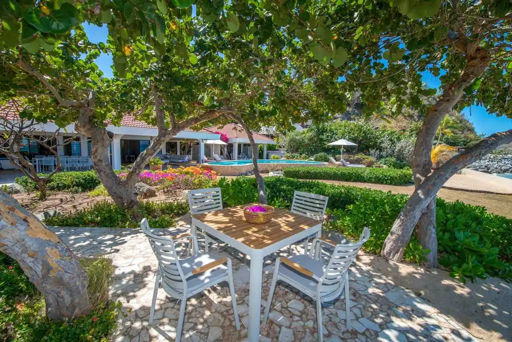 Sea Palms' garden with outdoor seating area